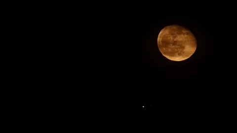 Full moon and airplane light on night sky Stock Footage 121625050
