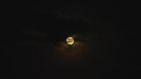 Full moon and clouds drifting across the sky - a magical moment at night. Stock Footage 331839108