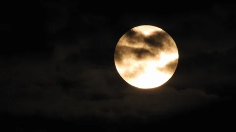 Full moon and clouds on a summer night sky. Moon With Clouds In The Night Sky. Video stock 114234114