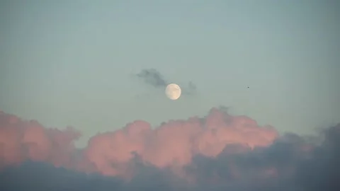 Full Moon and red sunset clouds passing. 4K realtime clip Stock Footage 138019155