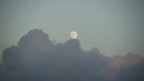 Full moon and sunset clouds and beautiful sunset clouds passing Stock Footage 136696869