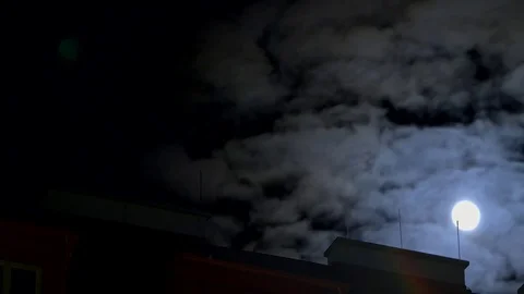 Full moon appears, clouds and roof Vídeo Stock 76099438