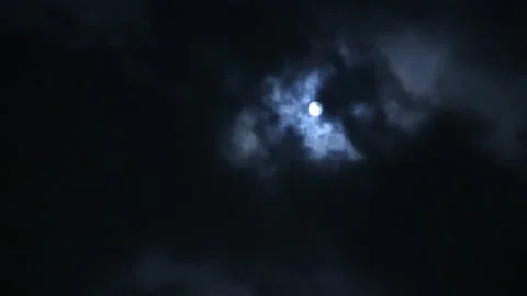 Full moon behind clouds at night Stock Footage 154850640