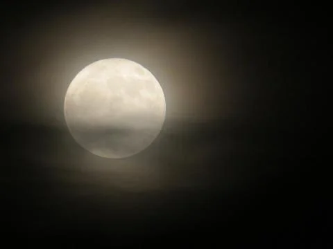 Full moon behind the clouds Stock Photos