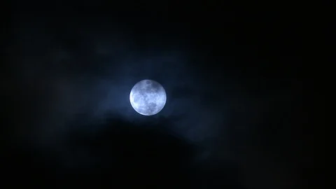 Full moon behind dark clouds Stock Footage 102863080
