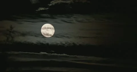 Full Moon Behind Eerie Moving Clouds at Night Stock Footage 317113950