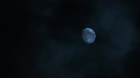 Full moon behind fast moving clouds at night Stock Footage 148823842