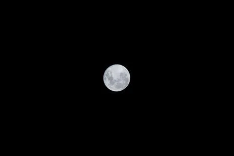 Full moon on black background Stock Photos