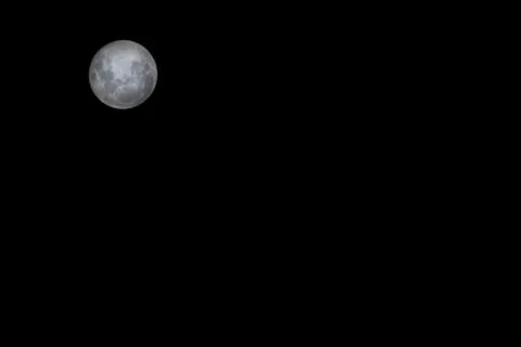 Full moon on black background Stock Photos