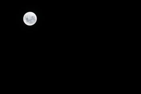 Full moon on black background Stock Photos