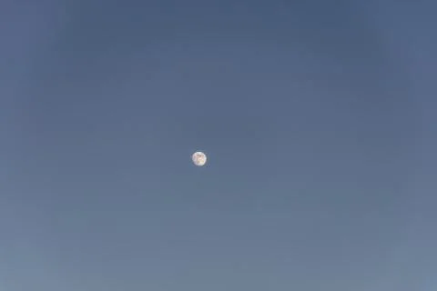 Full moon on a blue sky - a cool picture for backgrounds and wallpapers Stock Photos