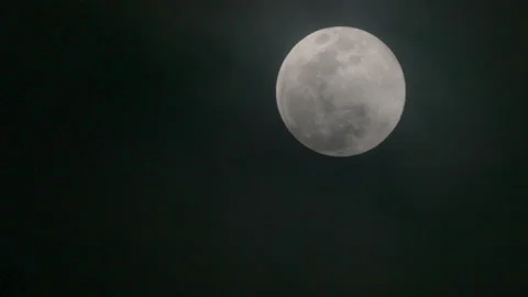 FULL MOON ON A CLOUDY NIGHT Stock Footage 228753086
