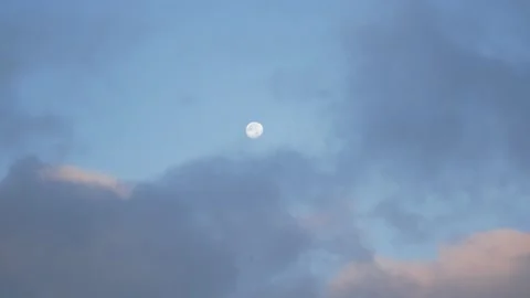 The Full Moon in a Cloudy Sky at Sunrise Stock Footage 155859548