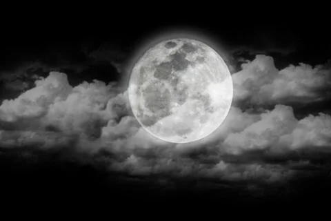 Full moon covered with clouds. Stock Photos