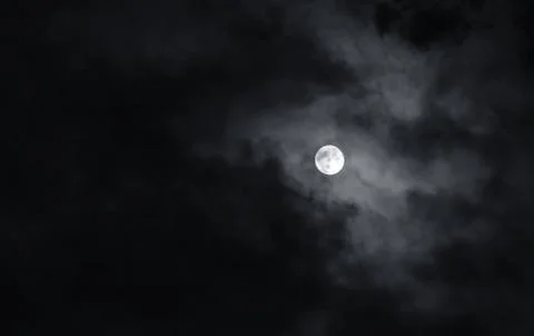 Full moon with dark clouds in the night sky Stock Photos