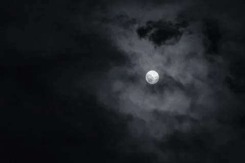 Full moon with dark clouds in the night sky Stock Photos