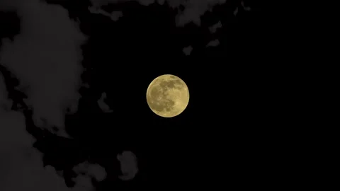 Full moon with dark clouds passing across the new moon Stock Footage 186676631