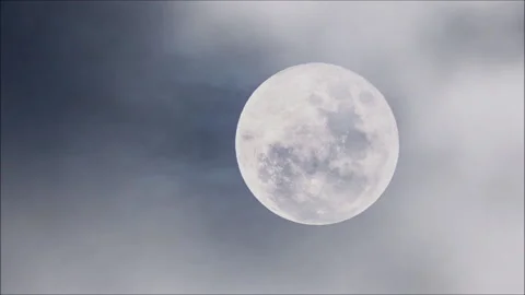 Full moon on dark cloudy night. Clouds passing by the moon. Stock Footage 188408916