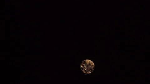 Full moon on dark cloudy night. Clouds passing by the moon Stock Footage 191827388