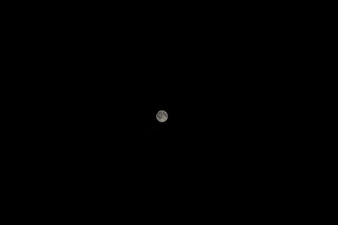 Full moon on dark night sky background Stock Photos