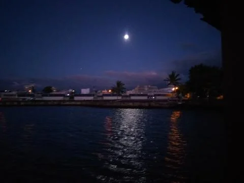 Full moon at the dawn in Mahebourg, Mauritius Stock Photos