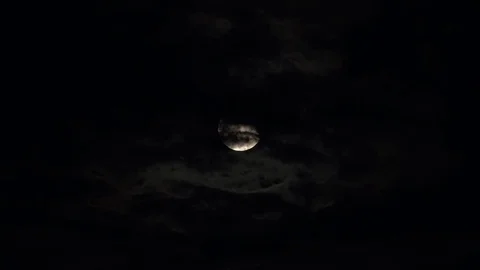 Full Moon Disappears Behind Dark Clouds Stock Footage 76443537