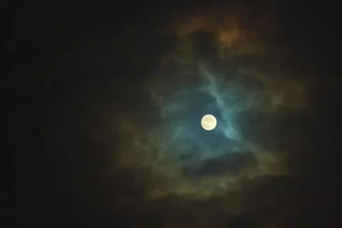 Full moon on dramatic cloudy sky Stock Photos