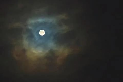 Full moon on dramatic cloudy sky Stock Photos