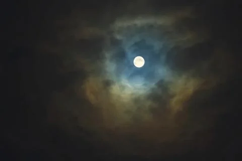 Full moon on dramatic cloudy sky Stock Photos