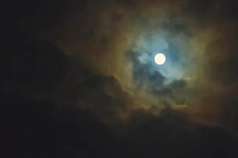 Full moon on dramatic cloudy sky Stock Photos