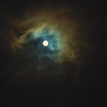 Full moon on dramatic cloudy sky Stock Photos