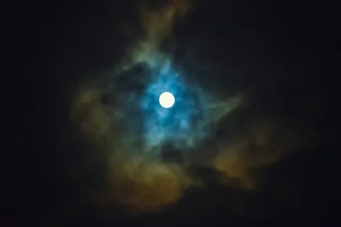 Full moon on dramatic cloudy sky Stock Photos