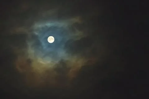 Full moon on dramatic cloudy sky Stock Photos