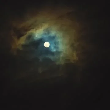 Full moon on dramatic cloudy sky Stock Photos
