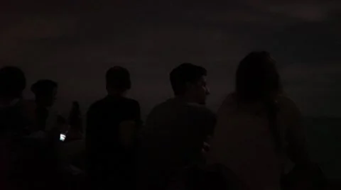 Full moon eclipse at beach with people Stock Footage 55309665