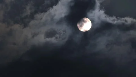 Full moon emerge from cloud moving pass after covering it in the nigh Stock Footage 243171803