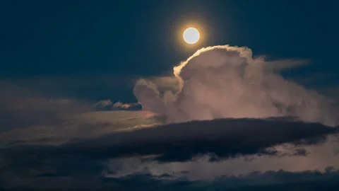 Full Moon Erupts Through Storm Clouds Stock Footage 282564123