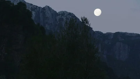 Full Moon Establishing Shot In The Forrest With Granite Mountains In The Back Stock Footage 70450747