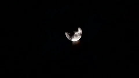 The full moon floating between the clouds in the night sky, the night and t.. Stock Footage 245807408