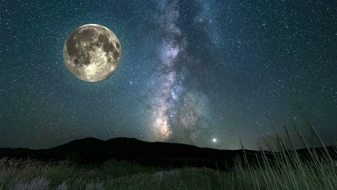 Full moon flying over a field at night Stock Footage 113390887