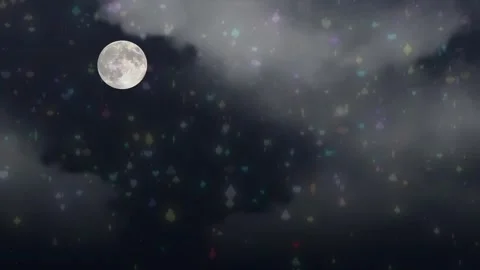 Full moon glowing amidst falling colorful playing card symbols against dark Stock Footage 340940577