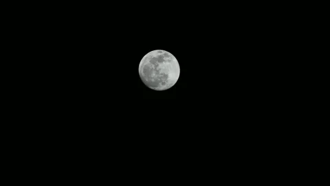 Full moon glowing in the dark night sky, detailed lunar surface. Video stock 339685551