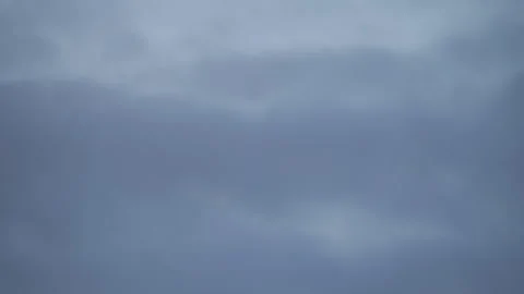 Full moon glowing through cloudy sky at the sunset. Stock Footage 320230486