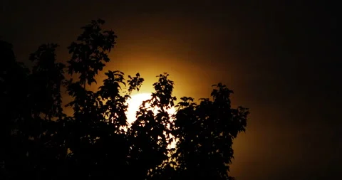 Full moon in a hazy night sky with surrounding aura Stock Footage 154743019
