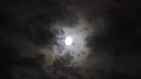 The full moon hides behind the clouds Stock Footage 136543212