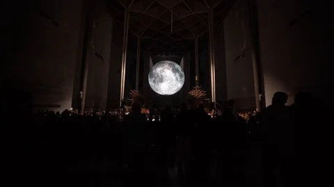 Full moon light installation suspended above in Coventry Cathedral Stock Footage 102181690
