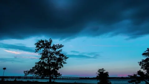 Full Moon with misty clouds over an expressway with car lights Time Lapse Ful Stock Footage 136993065