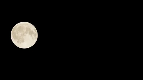 The Full Moon Moves Across the Black Sky Stockbeeldmateriaal 346370629