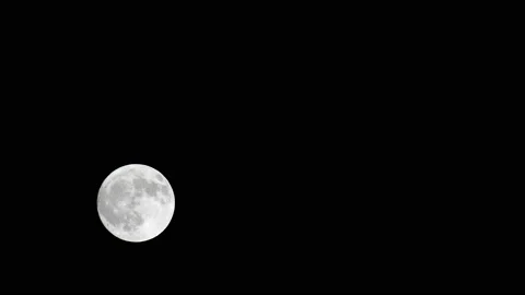 The full moon moves across the sky. Time lapse. Isolated on black background. 4K Stock Footage 121509352