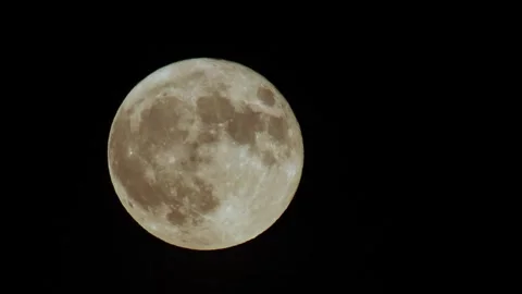The full moon moves in the black sky. Time lapse. Macro photography. Natural Stock Footage 312144658